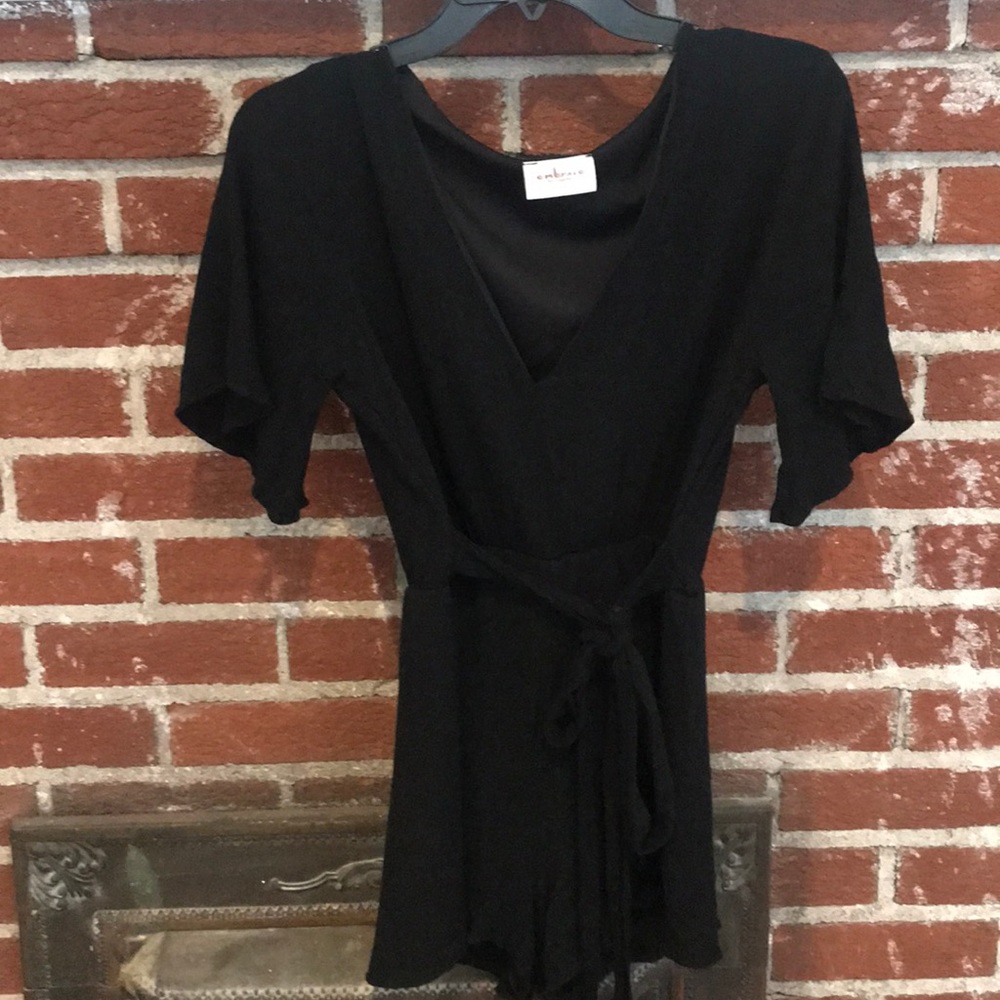 Black romper size large but fits a medium